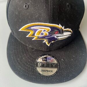 Baltimore Ravens New Era Black Snapback Hat with Purple and Gold Logo